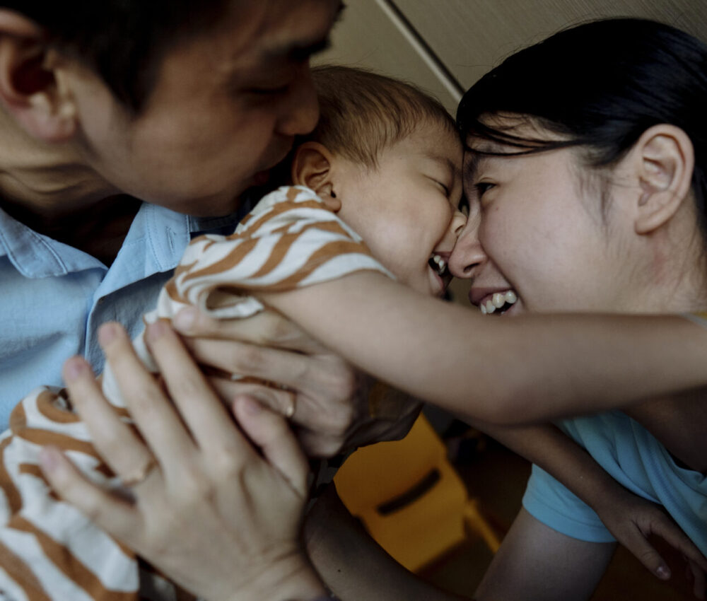 40_FamilyHuggingAndLaughing